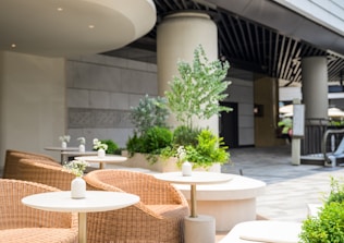 a couple of tables and chairs outside of a building