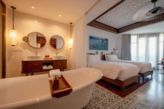 a bathroom with two beds and a bathtub