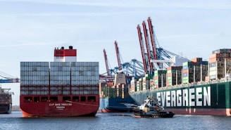a large cargo ship and a smaller boat in the water