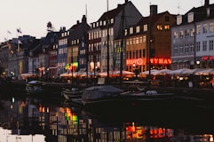 a row of buildings next to a body of water