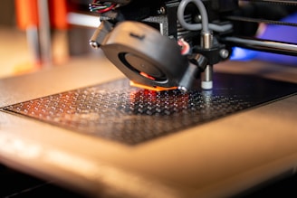 a close up of a machine with a red light on it