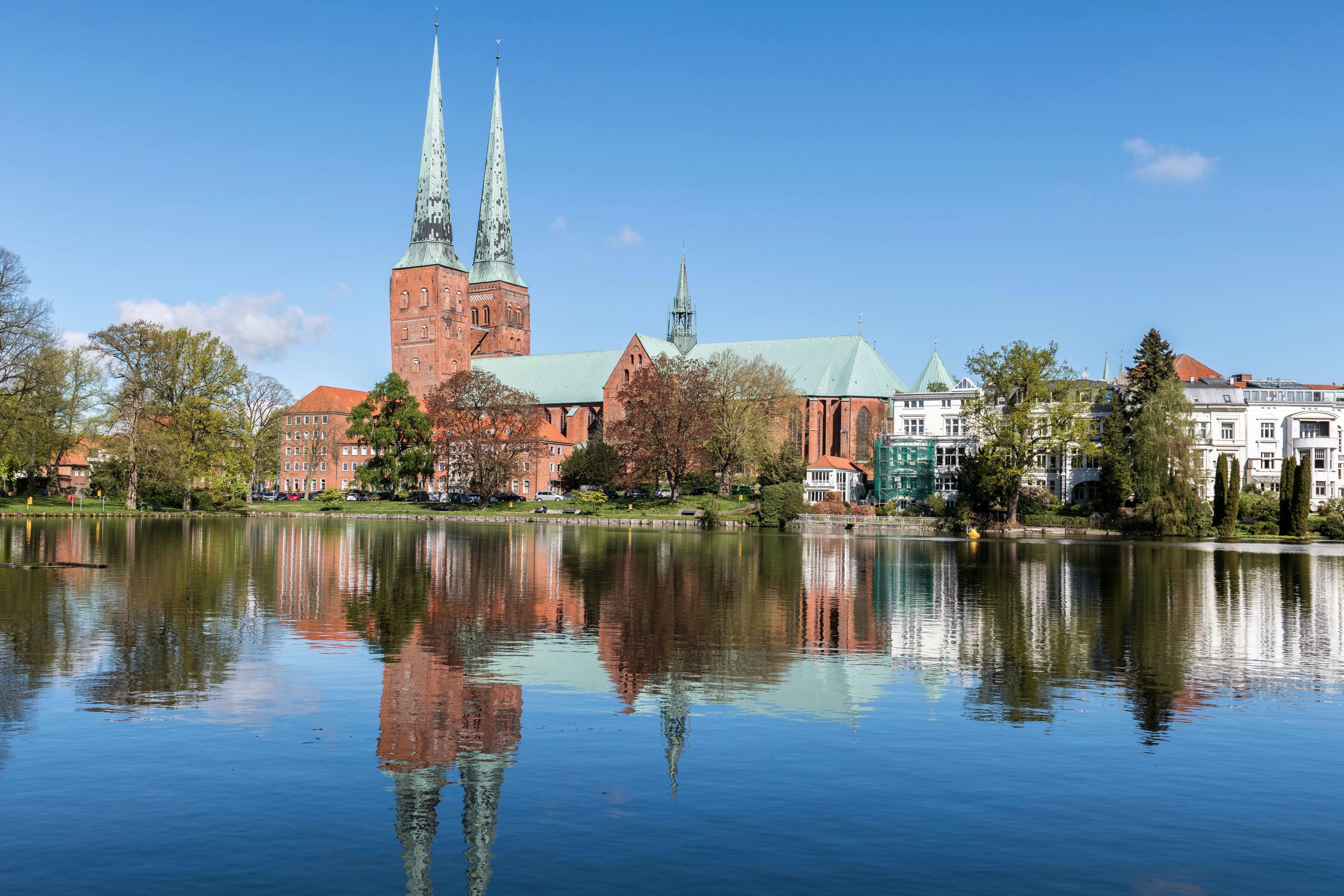 a lake with a church in the background