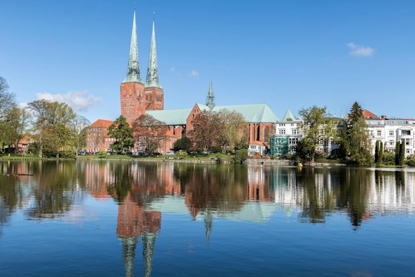 A lake with a church in the background — Lübeck, Germany