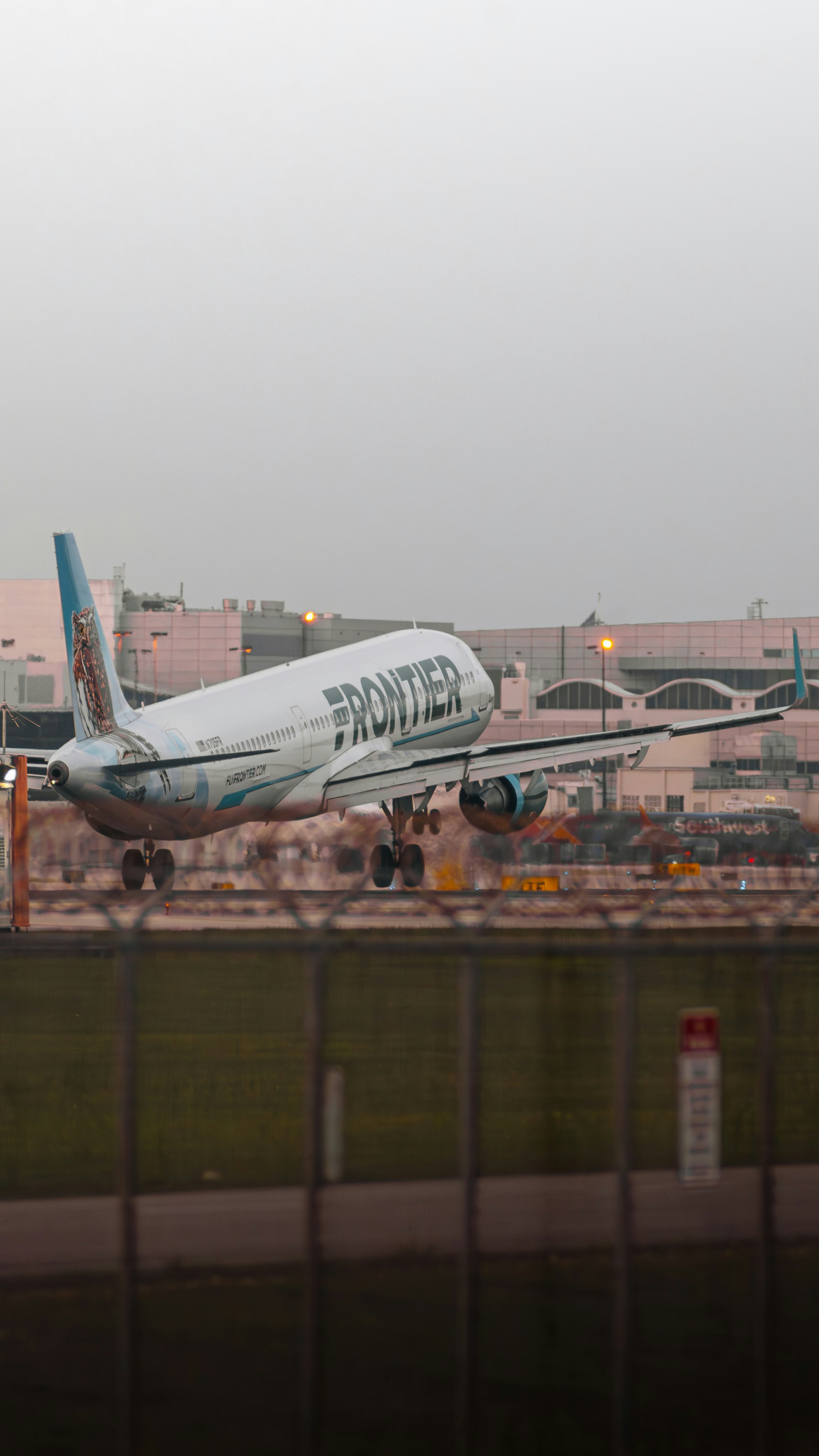 a large jetliner taking off from an airport runway