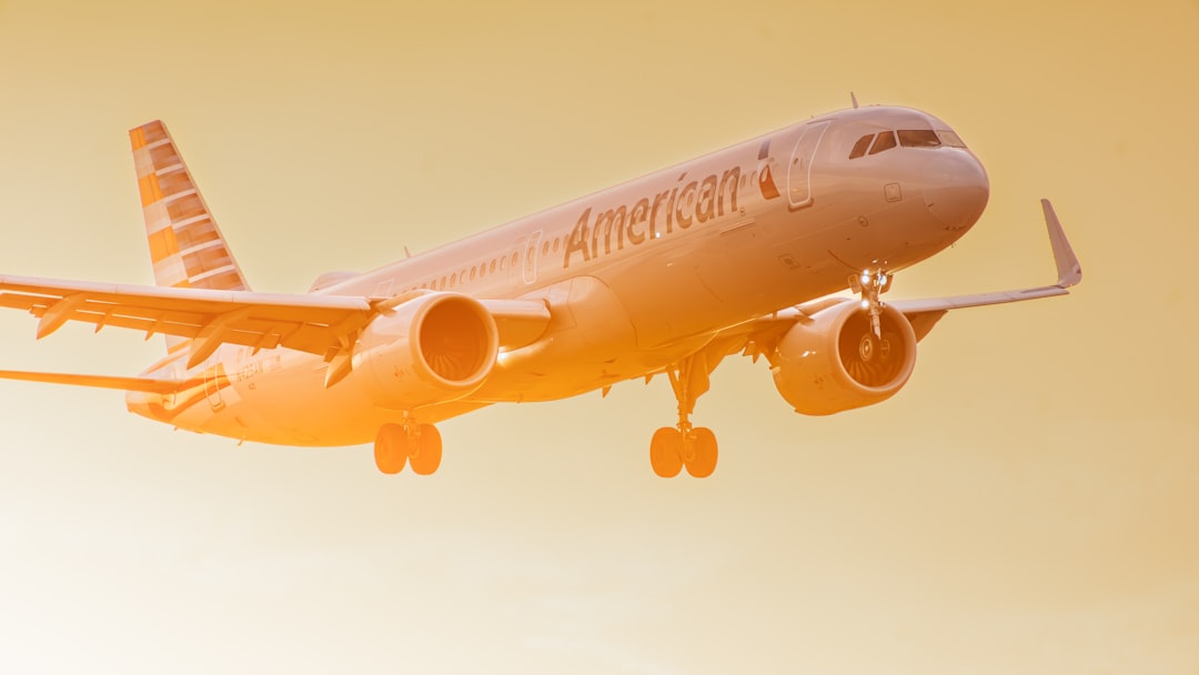 an american airlines plane flying in the sky,