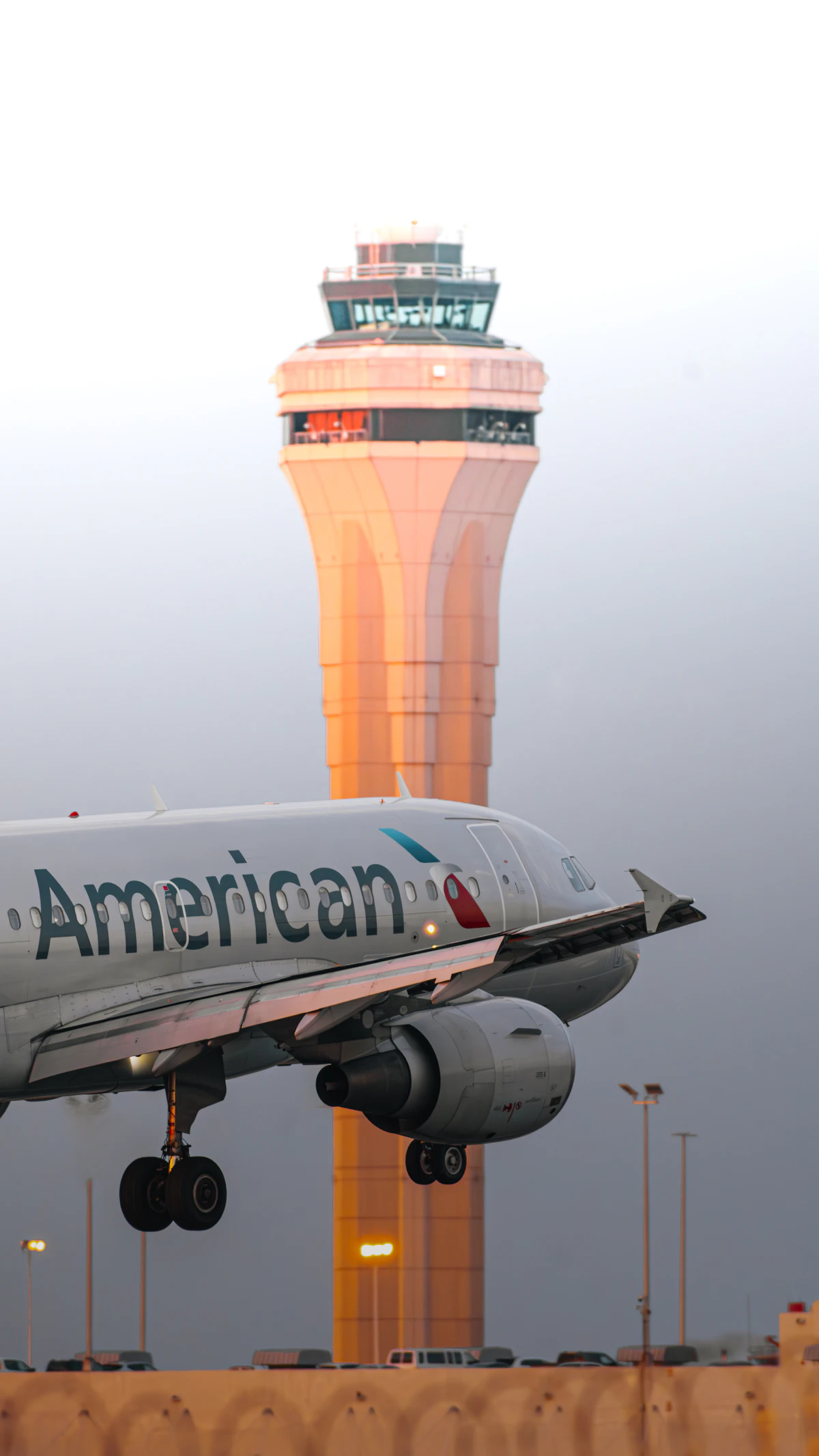 An American Airlines jet taking off from an airport