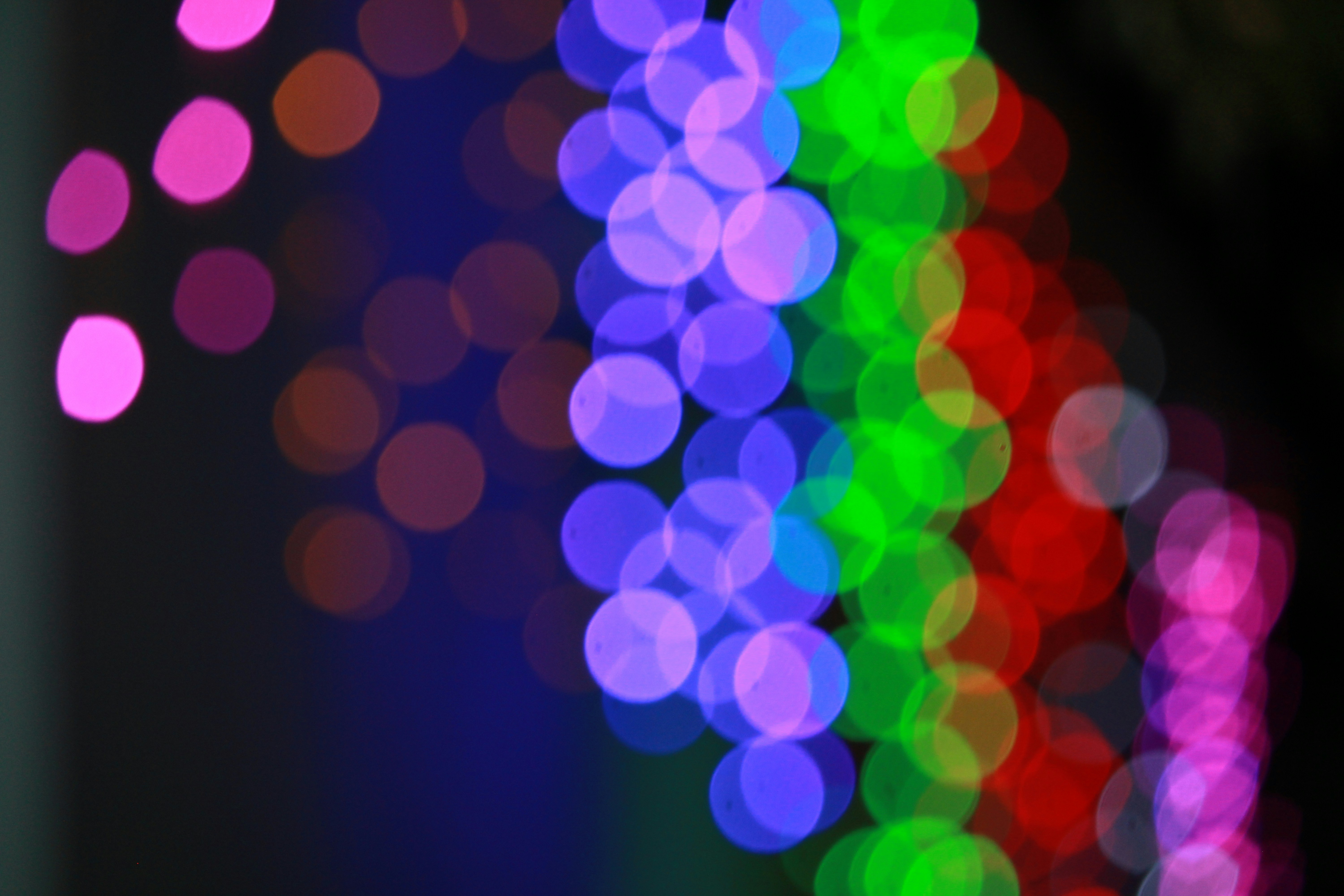 A blurry photo of colorful lights in the dark
