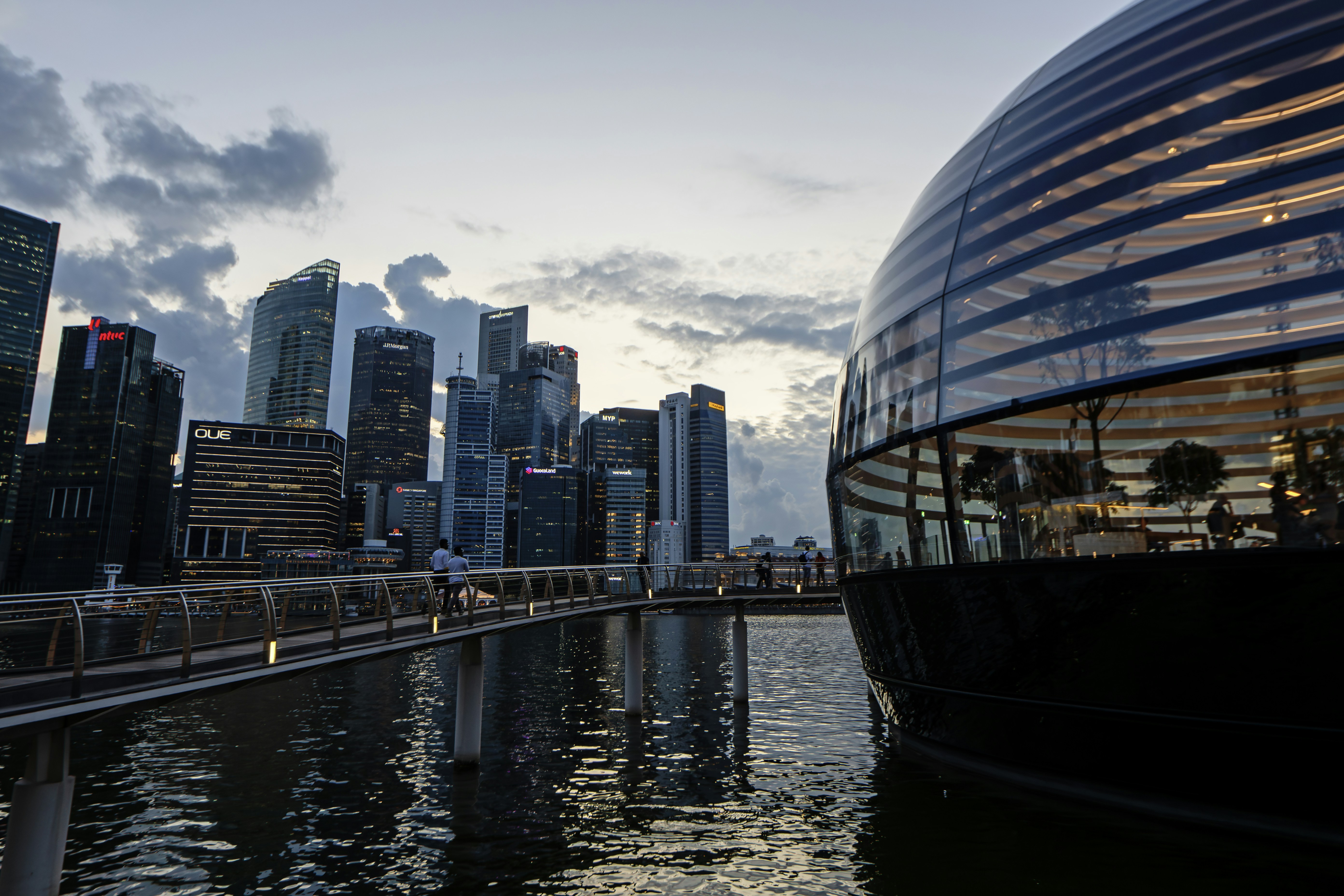 a large body of water with a city in the background
