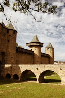 a stone bridge with two towers on top of it