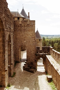 an old castle with a stone walkway leading to it