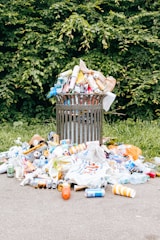 a trash can filled with plastic bottles and other trash