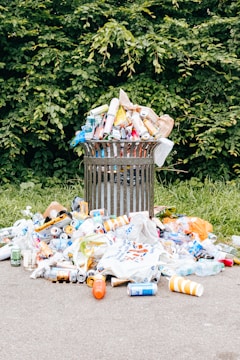 a trash can filled with plastic bottles and other trash