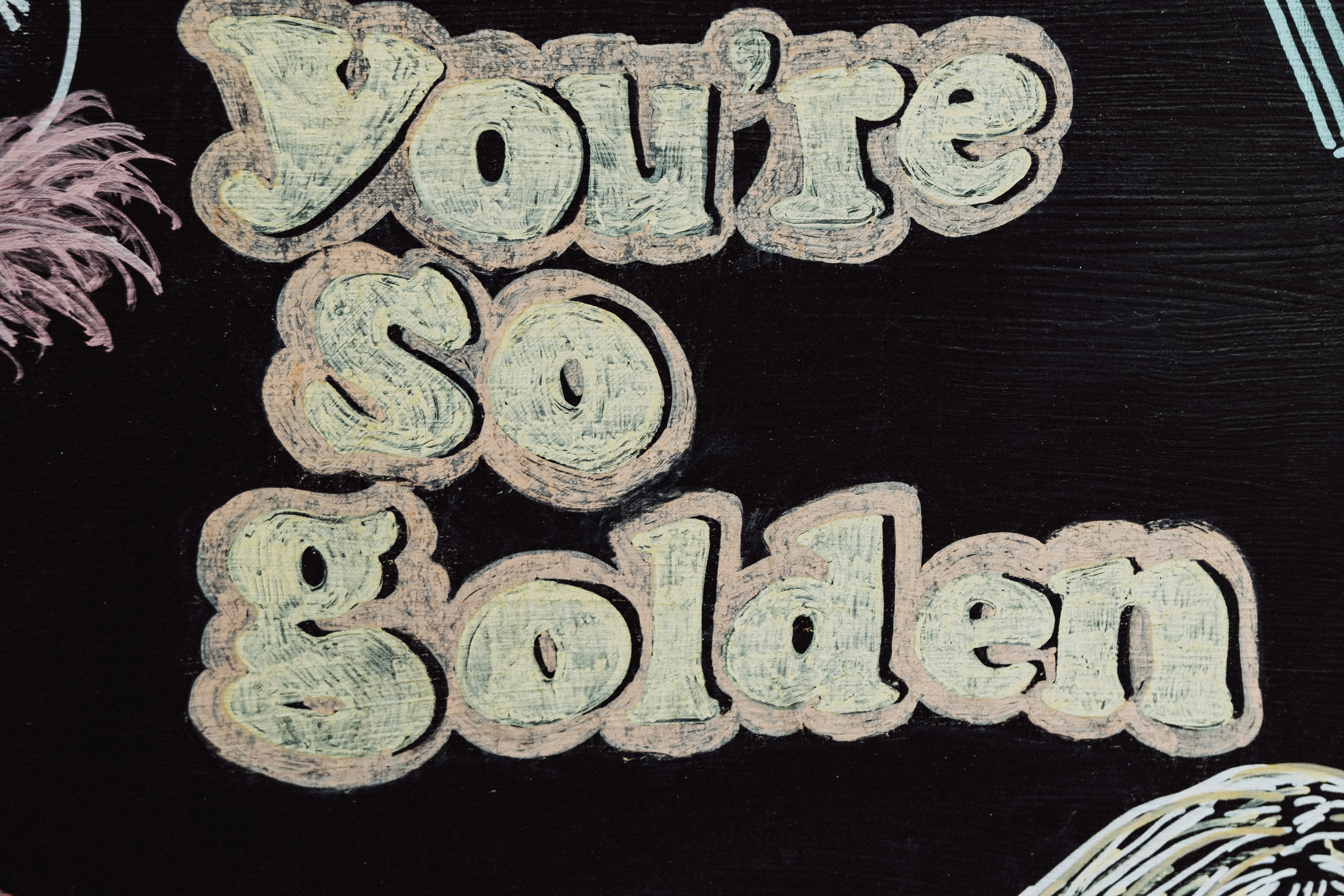 a picture of a sign that says you're so golden