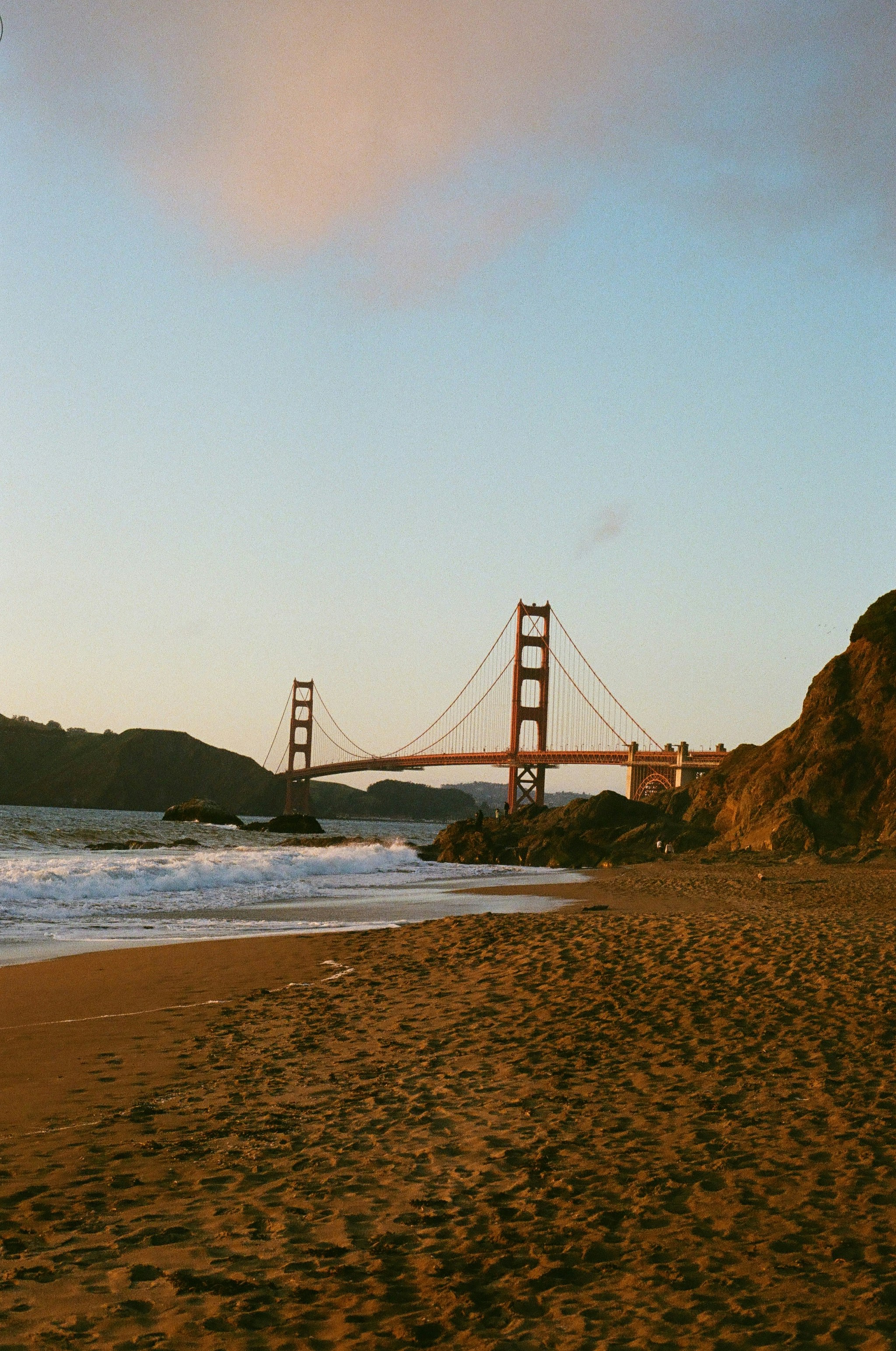 a view of the golden gate bridge from the beach