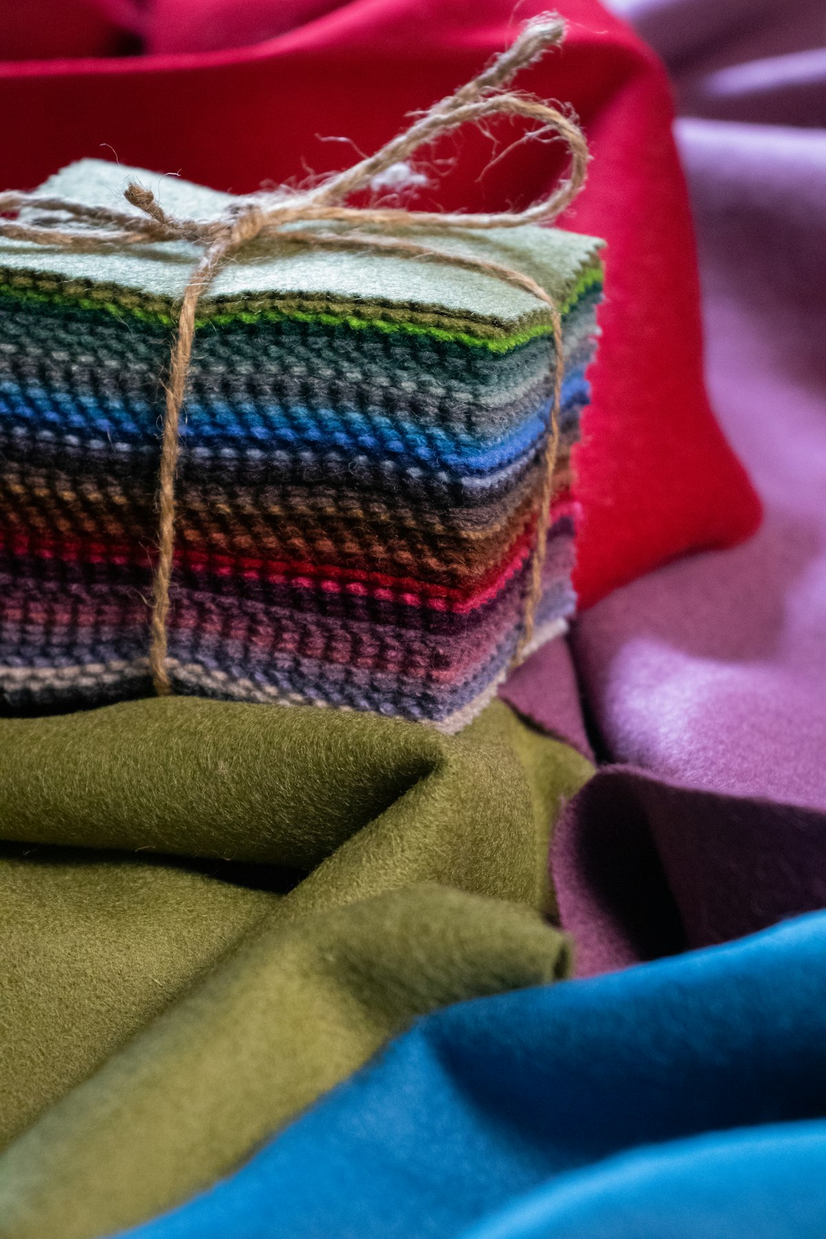 Stacked coloured upholstery fabric swatches