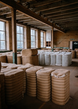 a warehouse filled with stacks of white plates