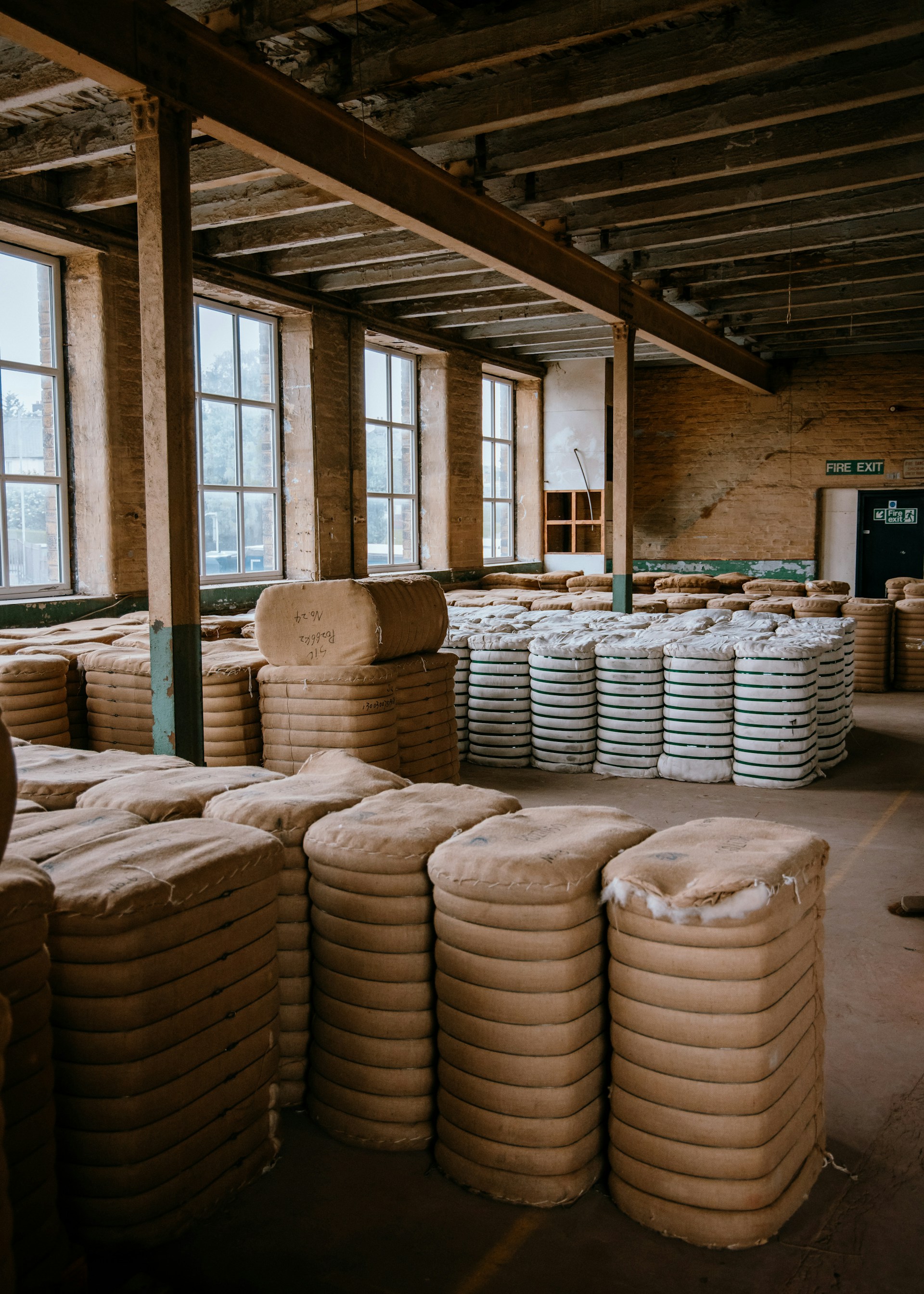 a warehouse filled with stacks of white plates
