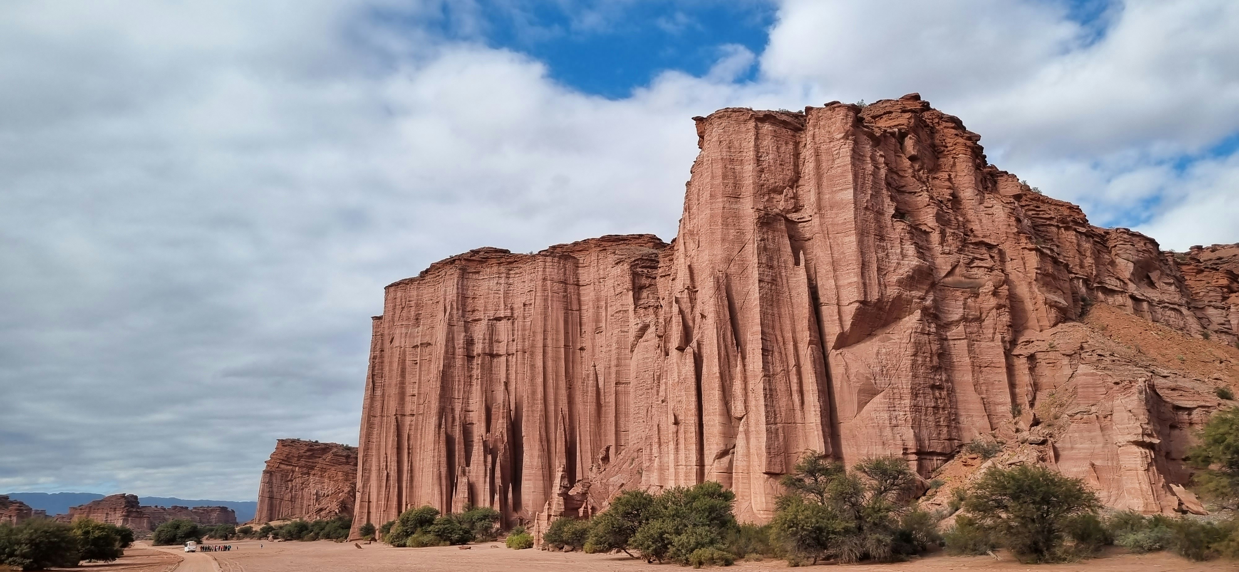 a large rock formation in the middle of a desert