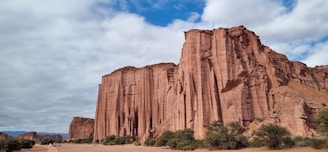 a large rock formation in the middle of a desert