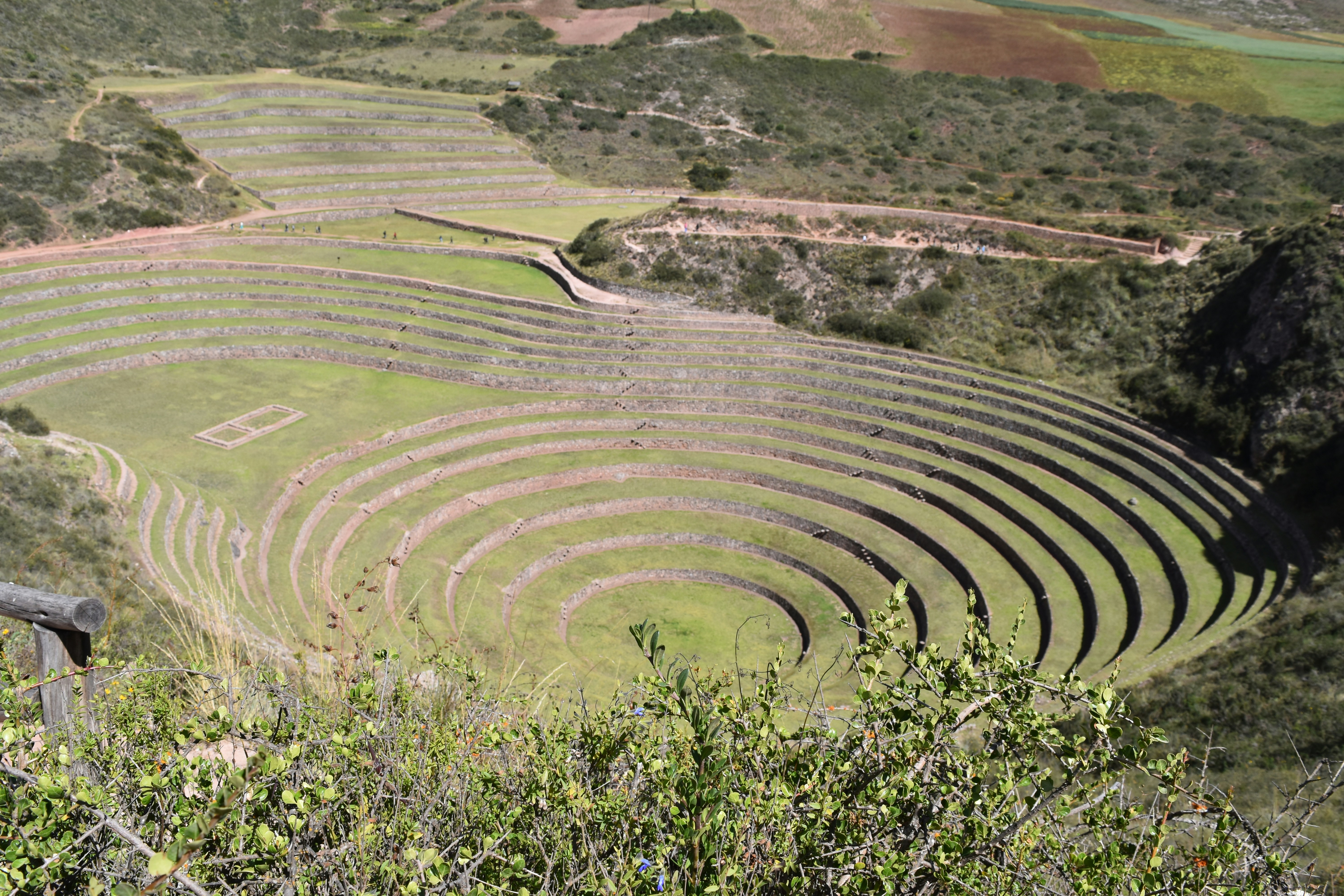 a large circular structure in the middle of a field