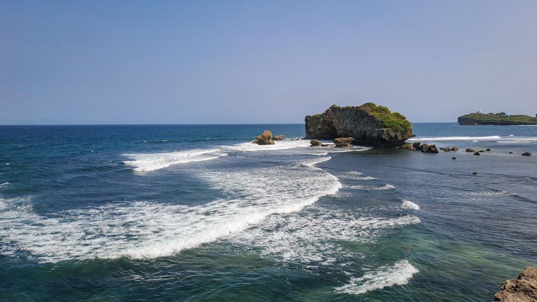 a body of water with waves coming in and out of it, The crashing waves of Sundak Beach