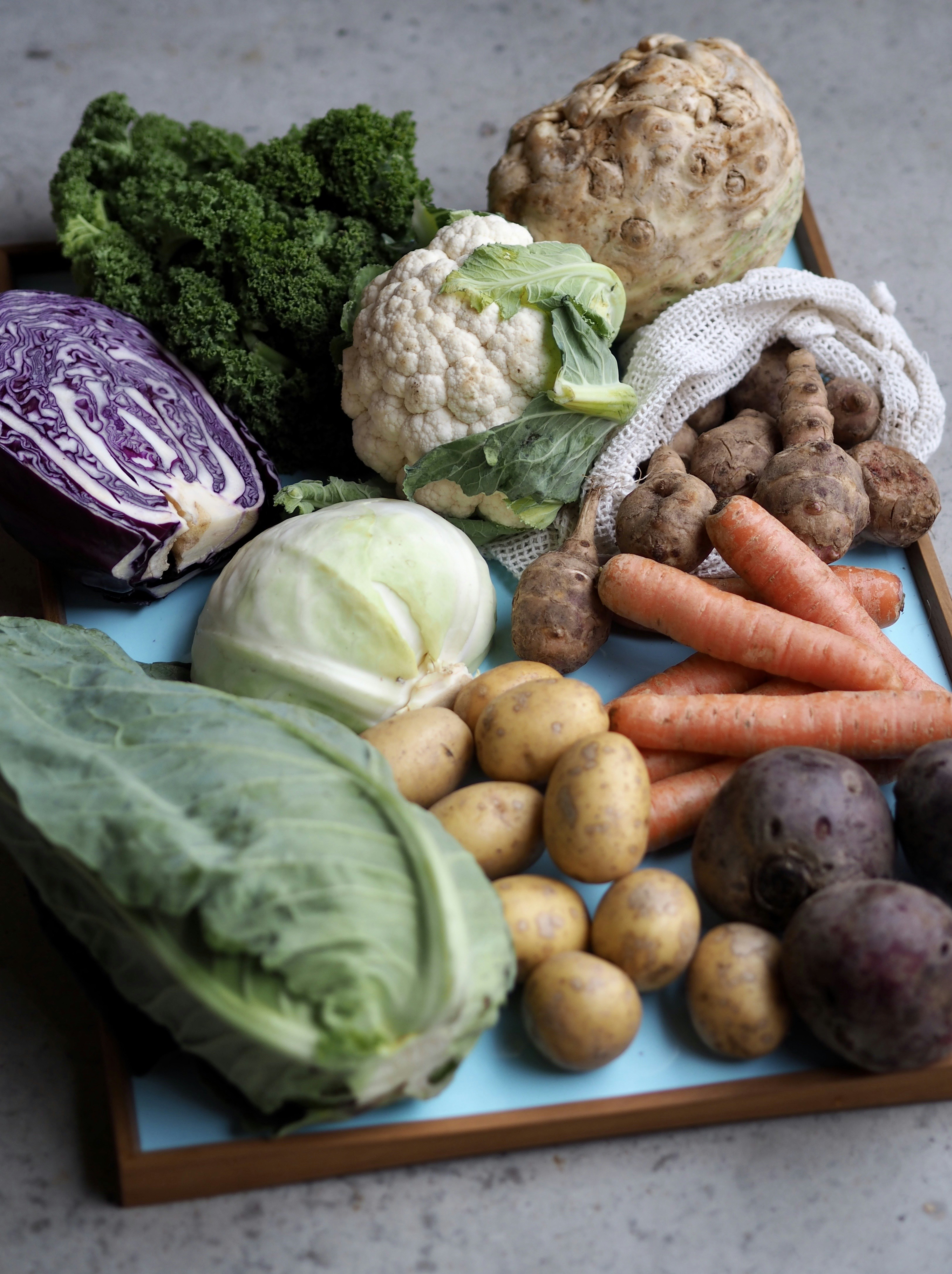 a tray filled with different types of vegetables