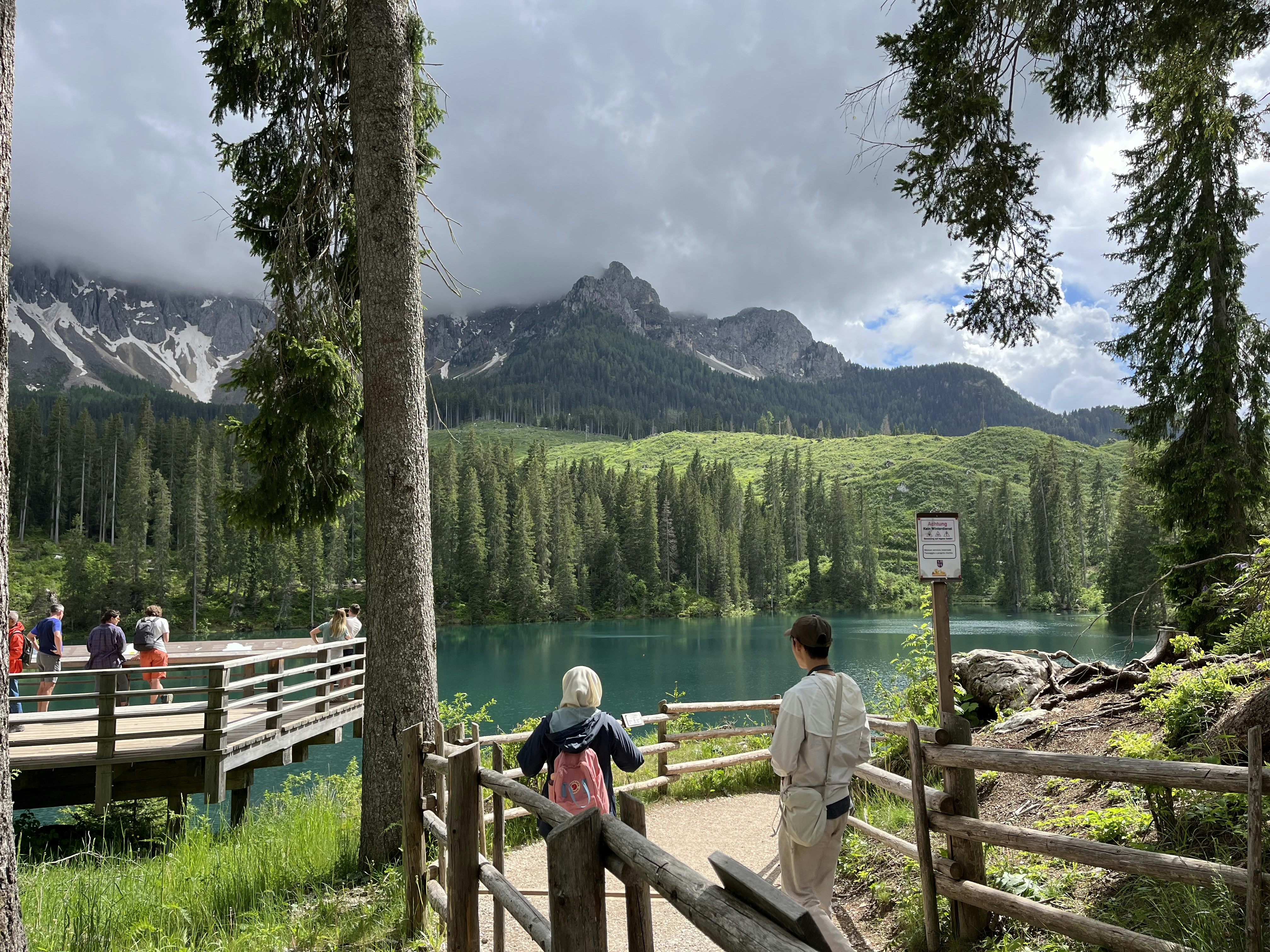 a couple of people that are standing on a bridge