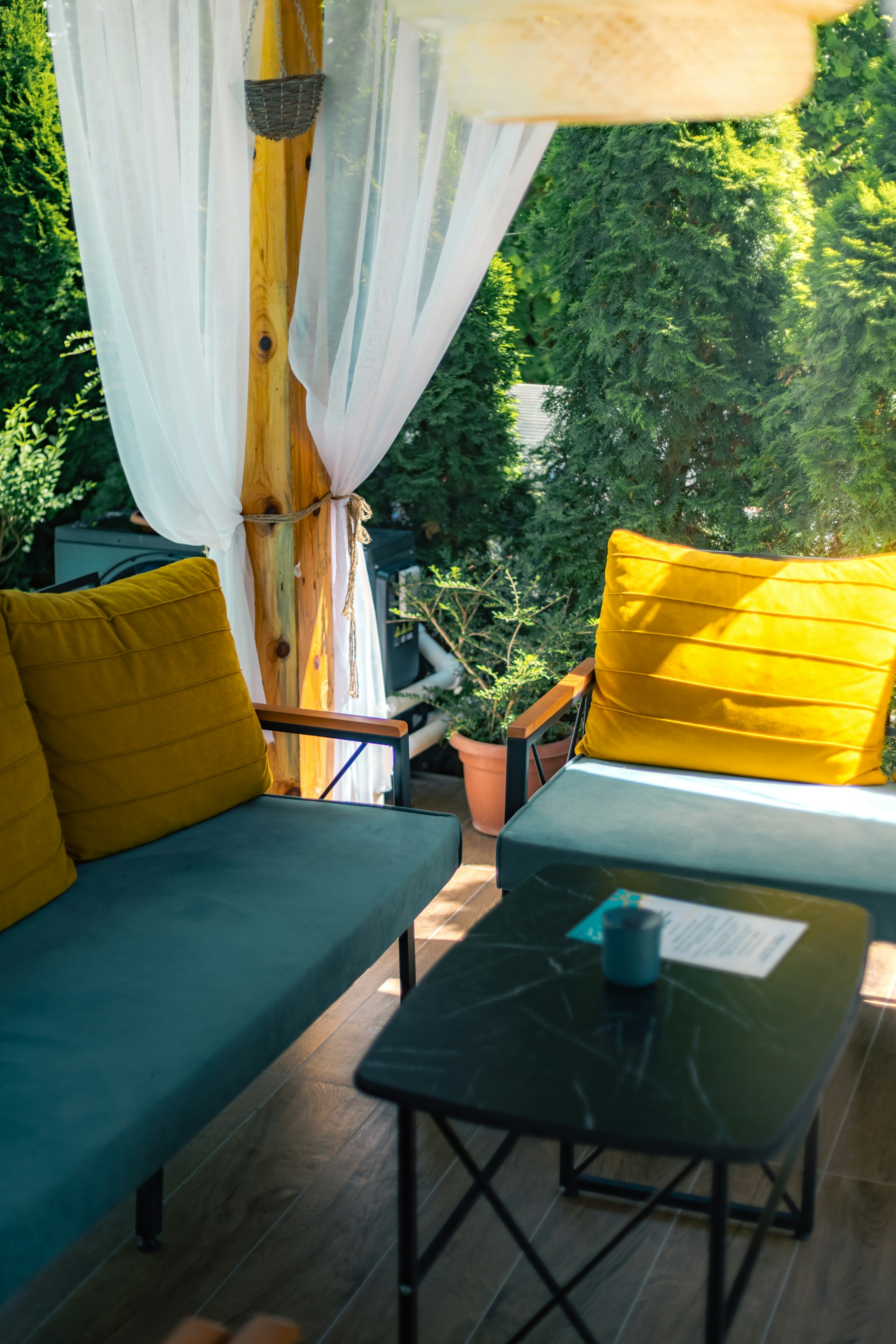 a couple of couches sitting on top of a wooden floor