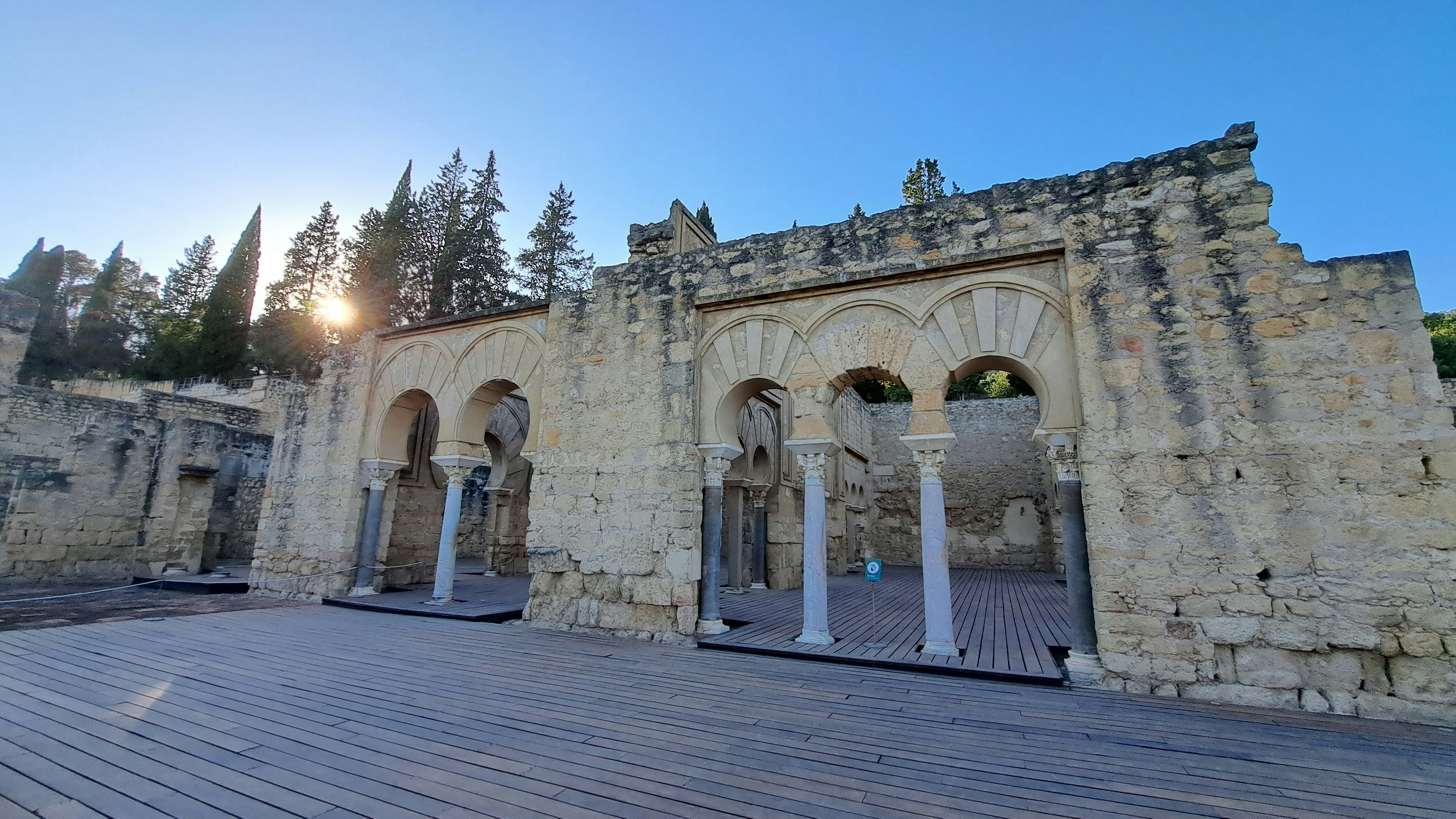 an old building with a wooden floor and stone walls
