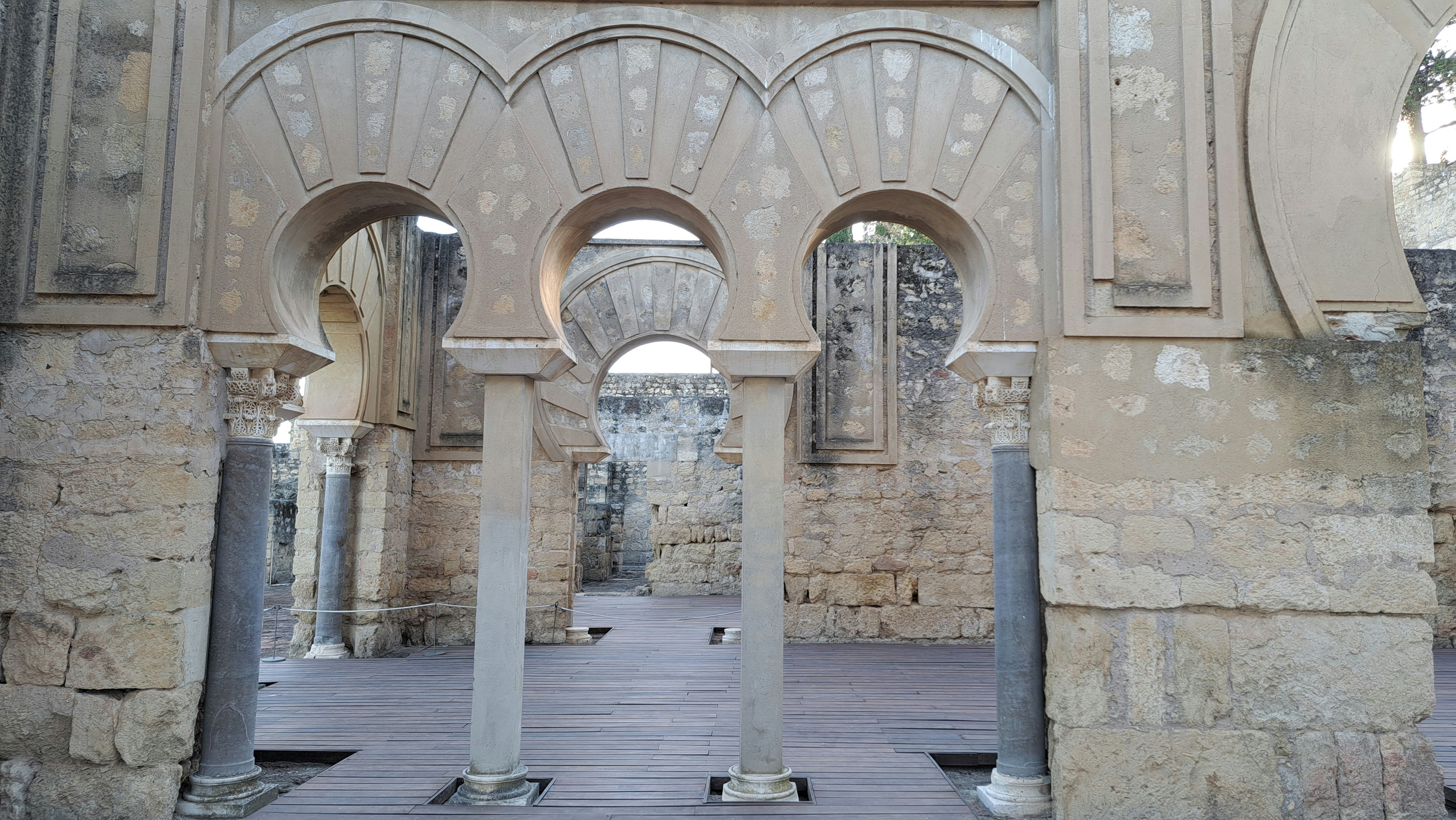 a stone building with arches and pillars inside of it, Medina Azahara, Córdoba, Spain