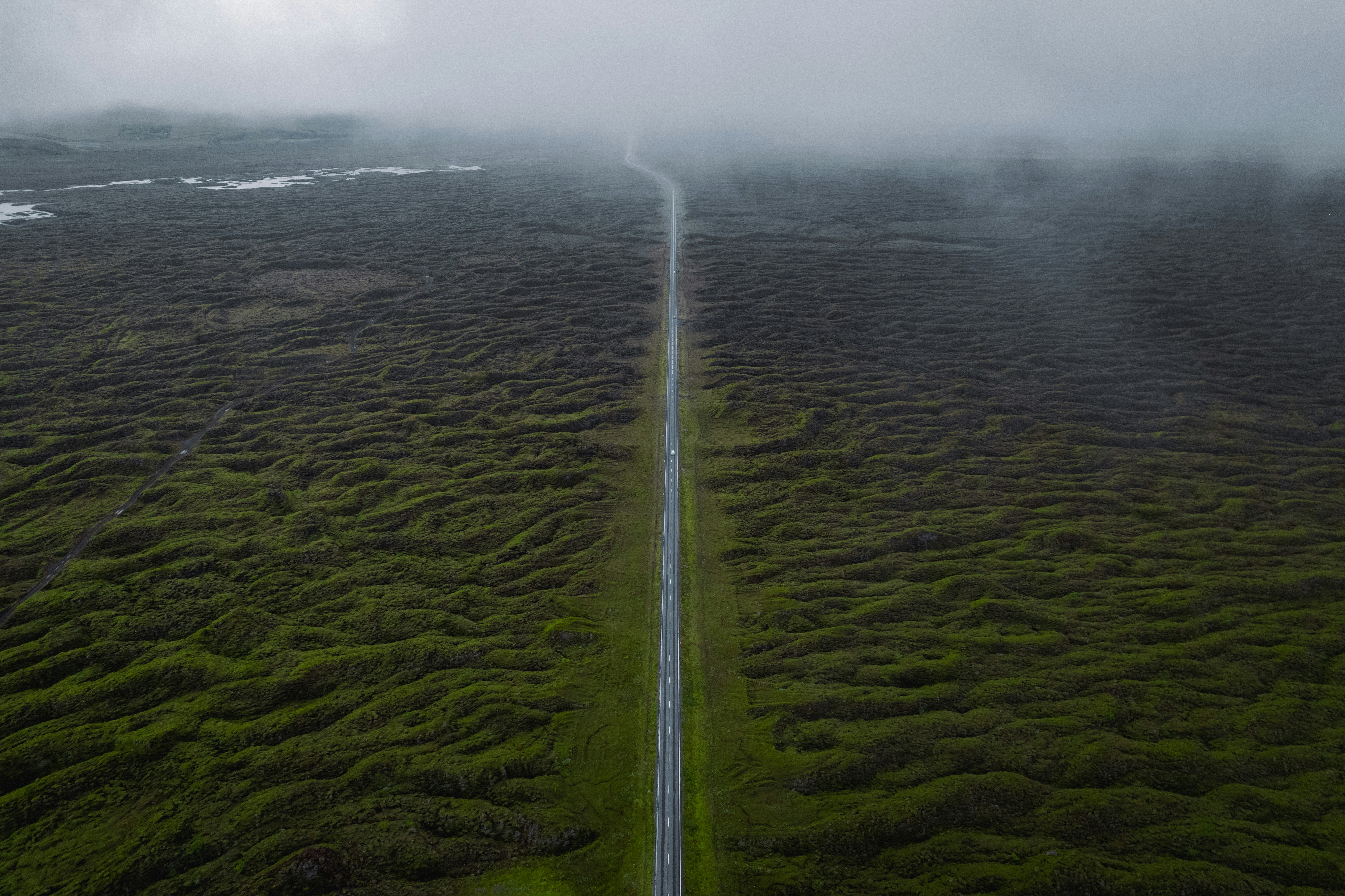 an aerial view of a road in the middle of a field, Roadtrip vibes