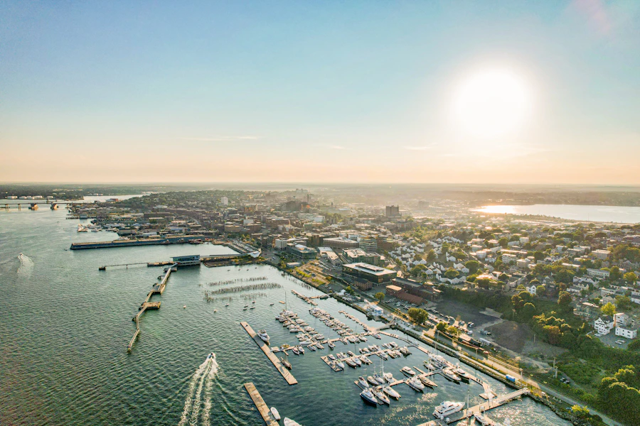 Aerial view of a harbor and town at sunrise