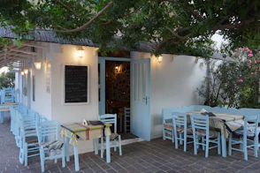a table and chairs outside of a restaurant