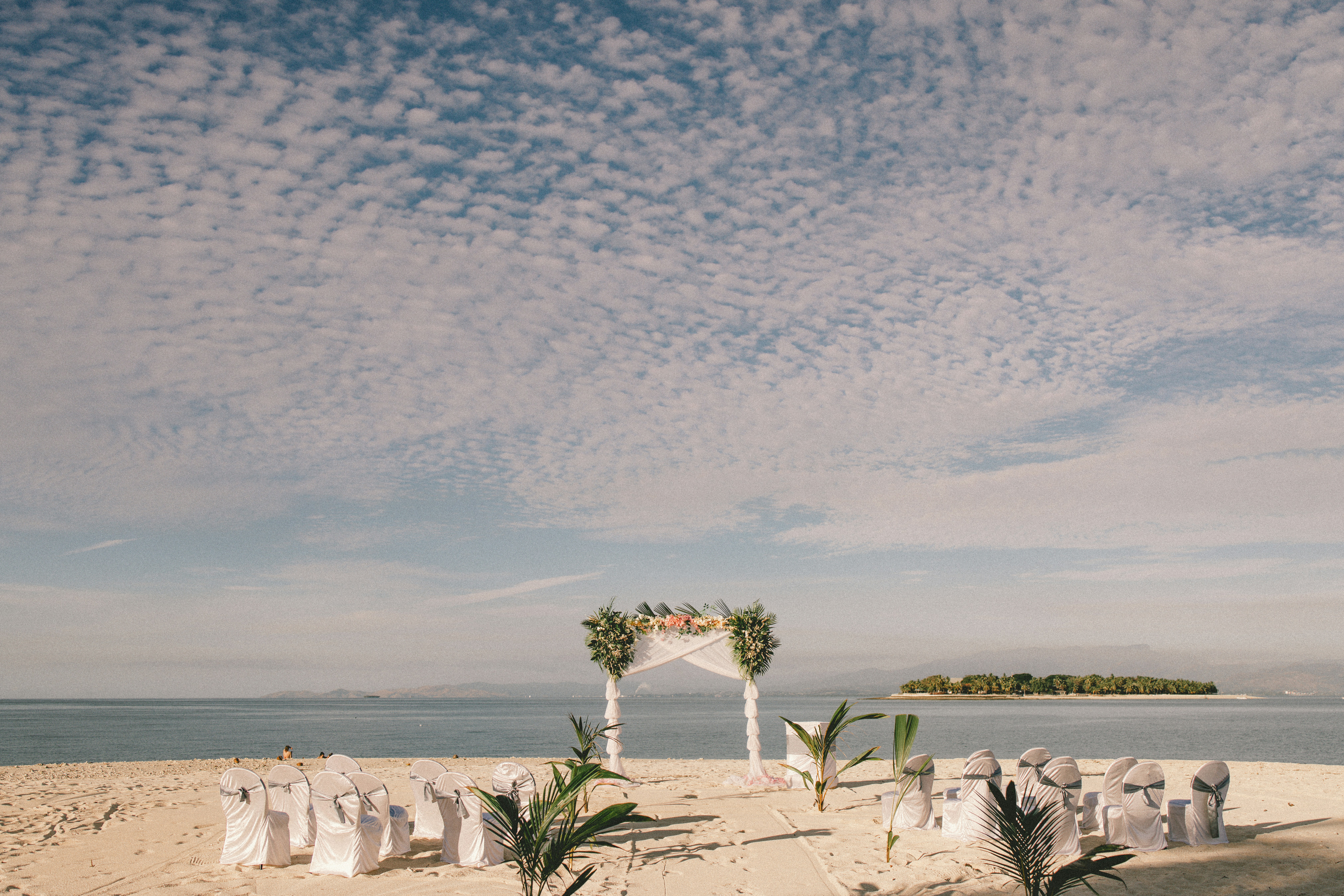 a wedding setup on a beach with a view of the ocean, Beachcomber Island, Fiji, by Josh Withers wedding and elopement celebrant