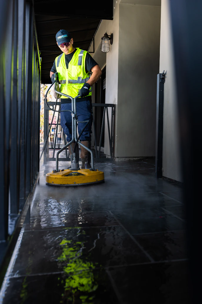 Power washing a paved patio
