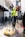 a man in a yellow vest is cleaning the street