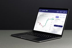 a laptop computer sitting on top of a table