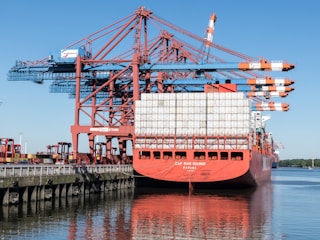 a large cargo ship docked at a dock