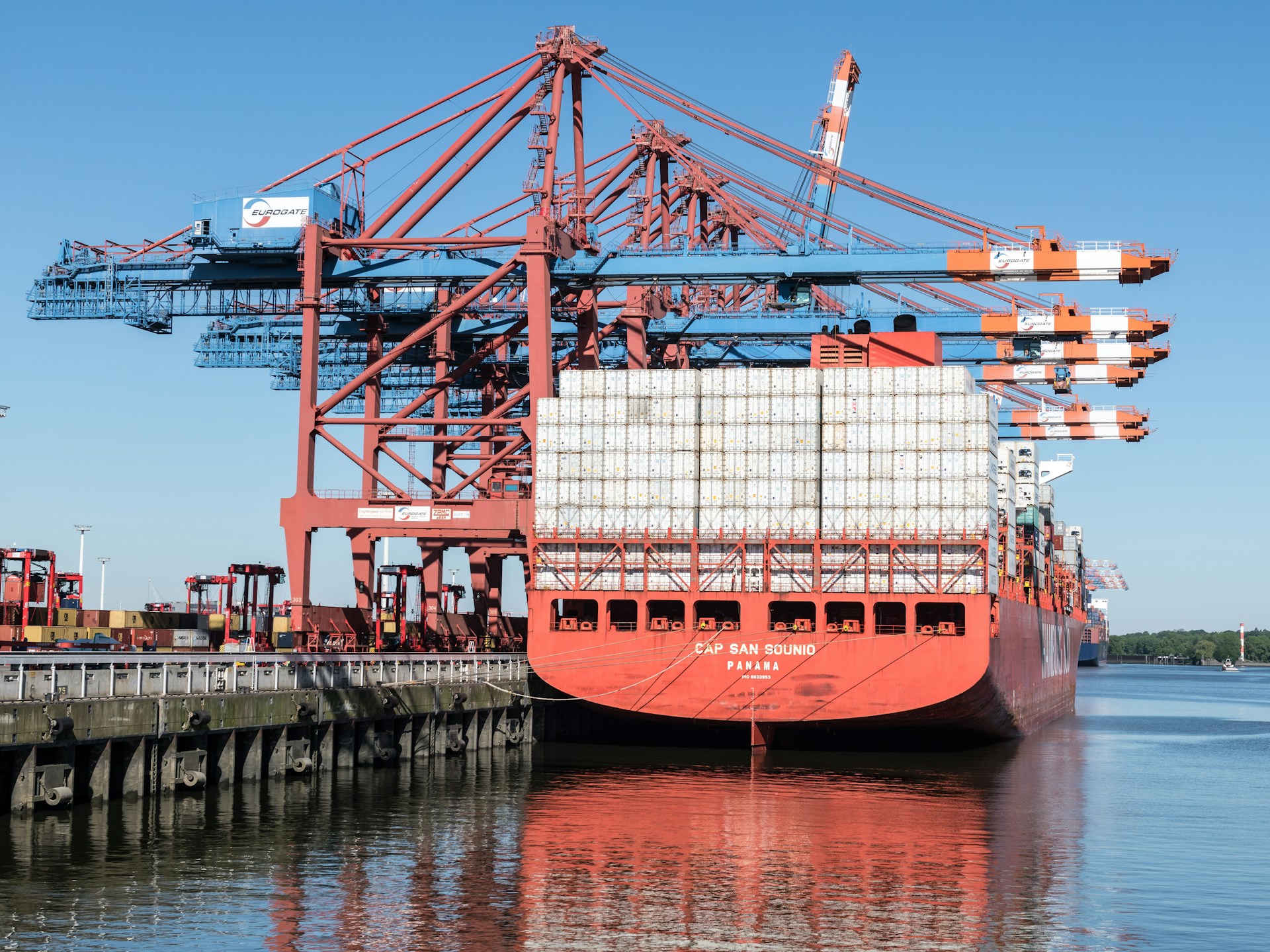 a large cargo ship docked at a dock