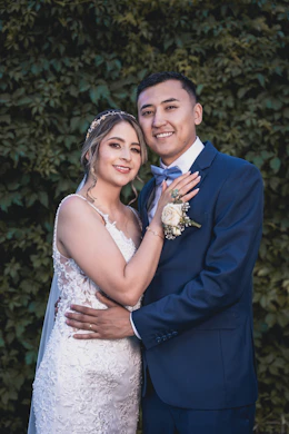 a bride and groom posing for a picture