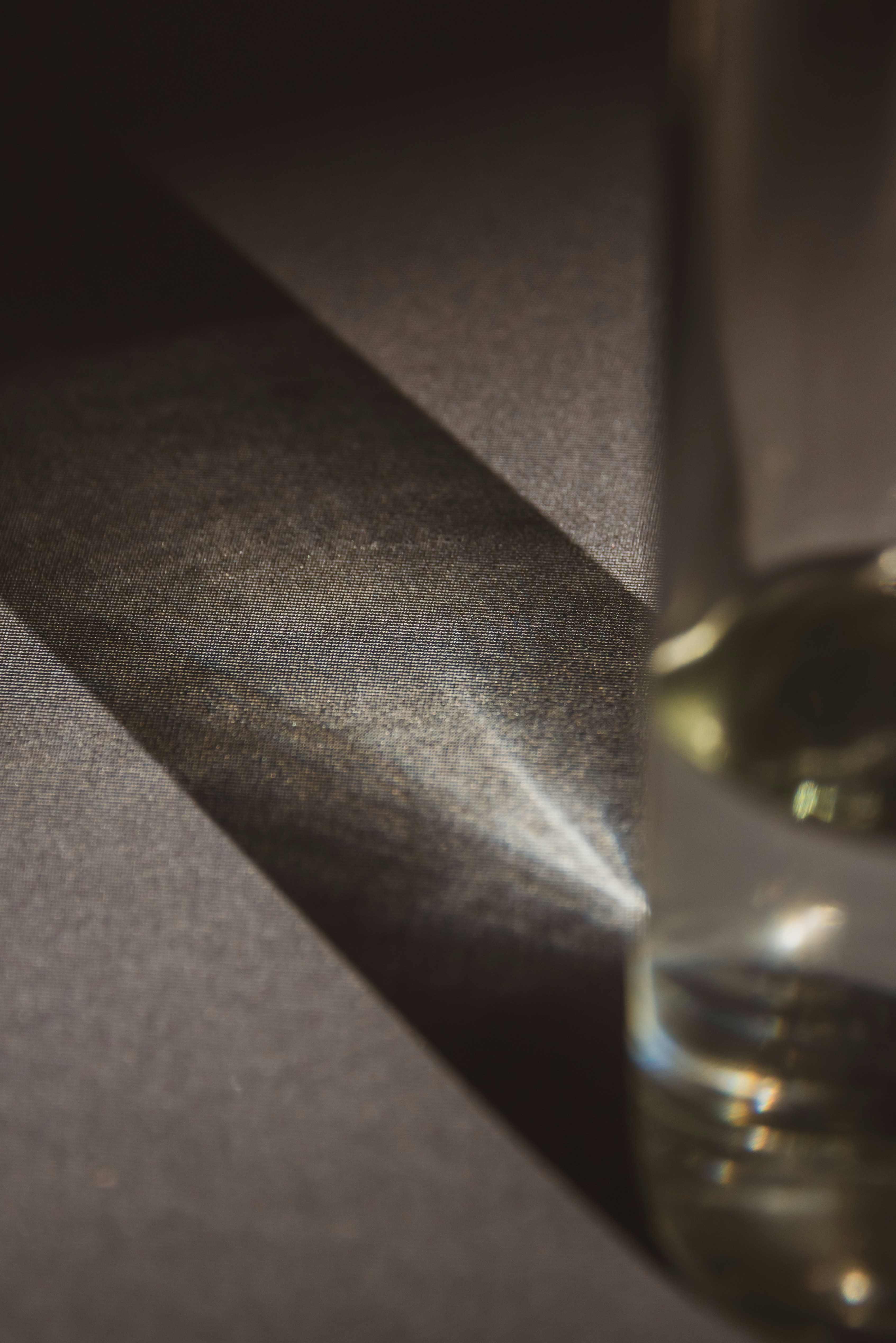 a small glass of water on a table