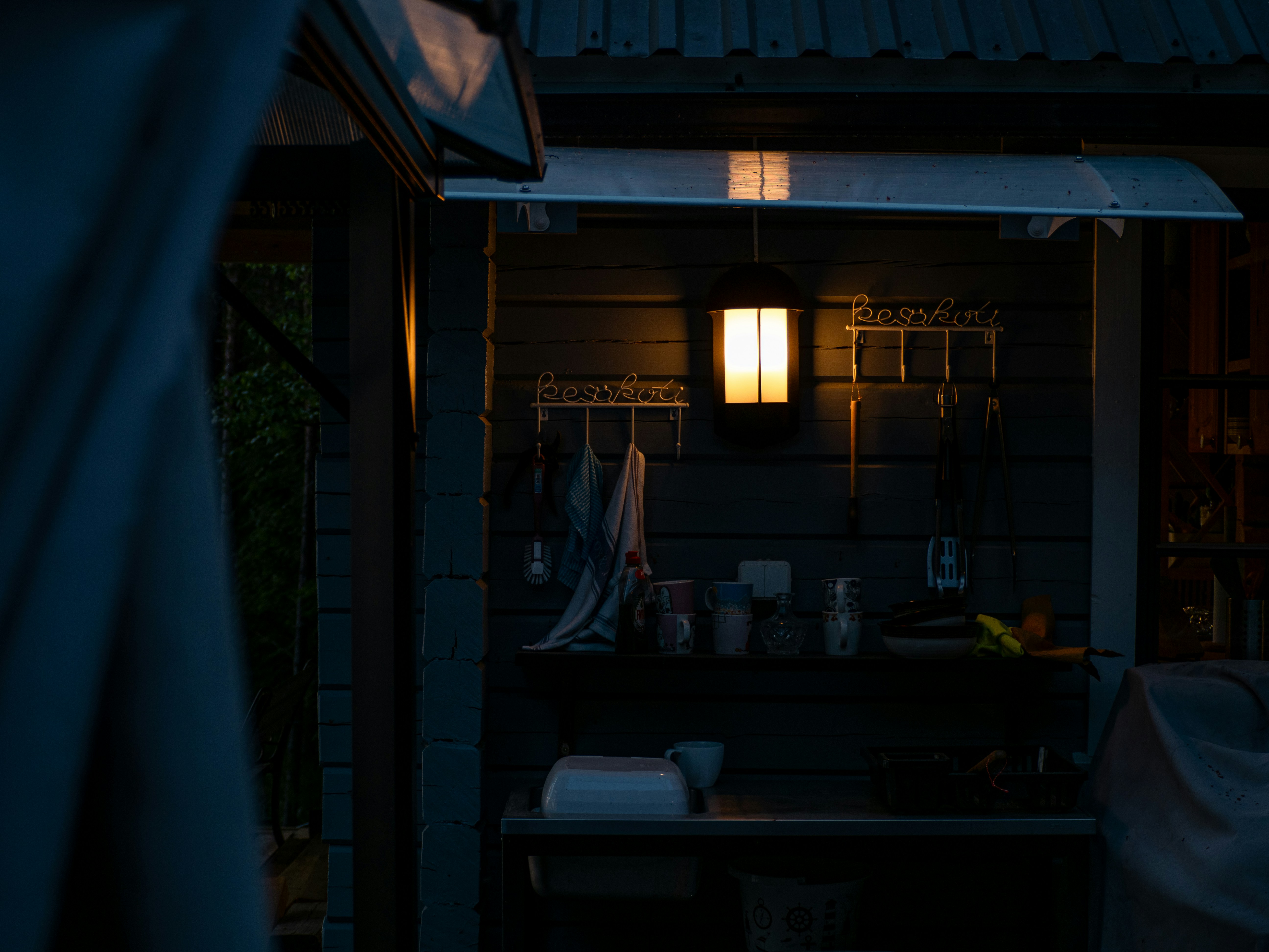 a dark room with a light on the outside of it