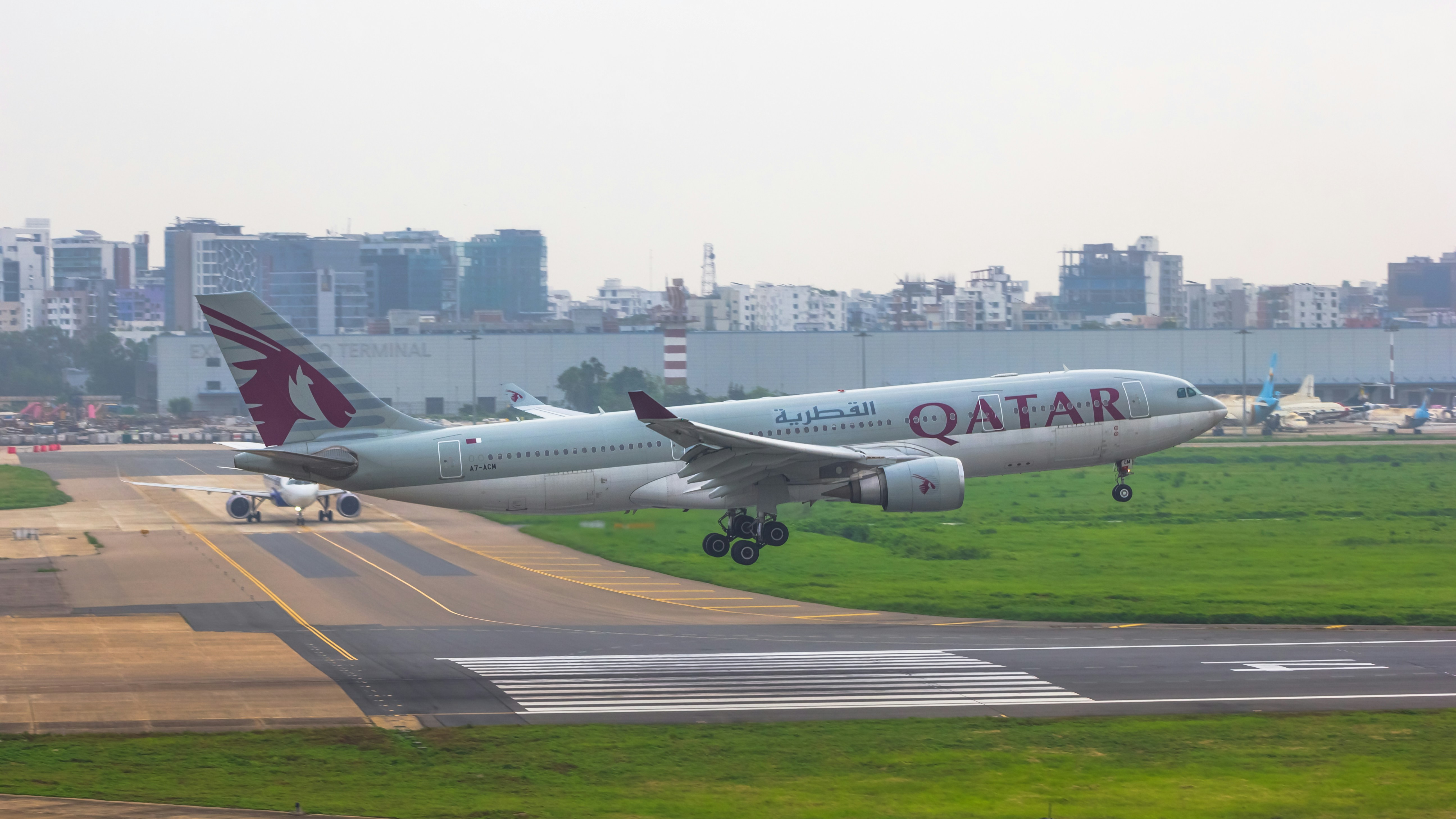 a large passenger jet taking off from an airport runway, 