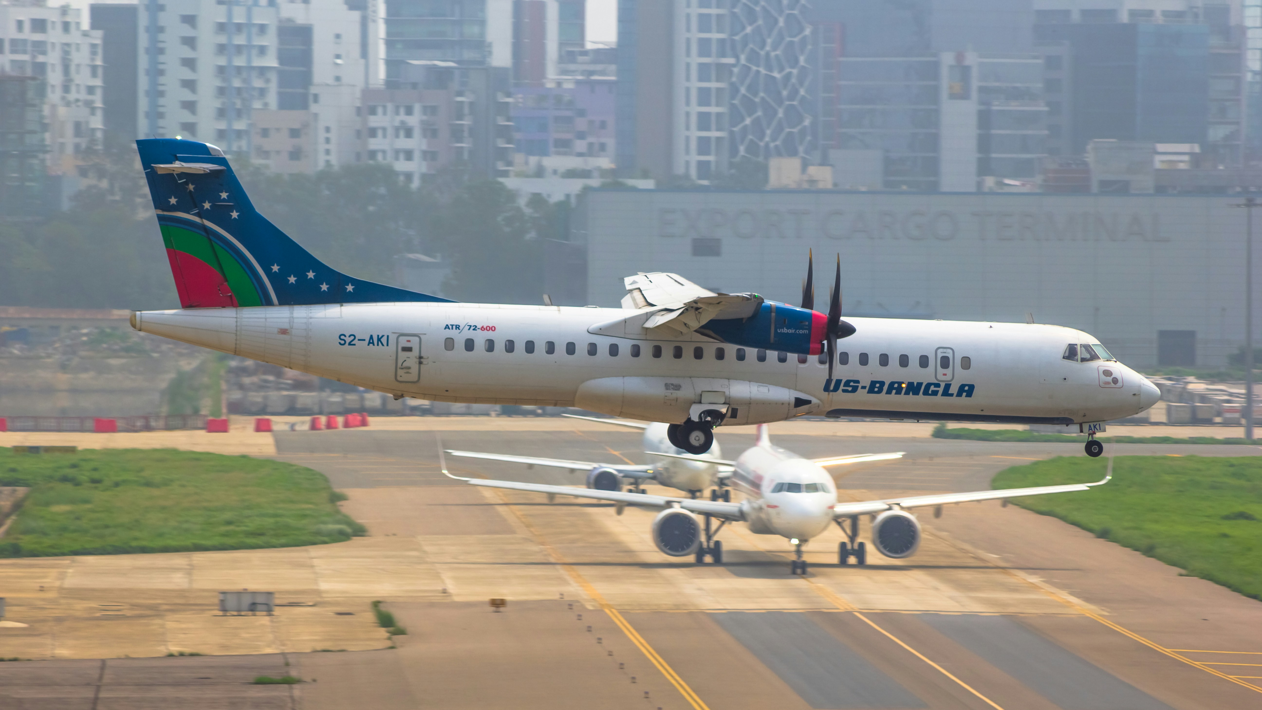a large jetliner taking off from an airport runway, 