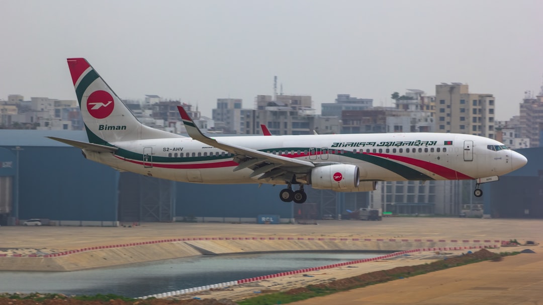 a large passenger jet taking off from an airport runway,