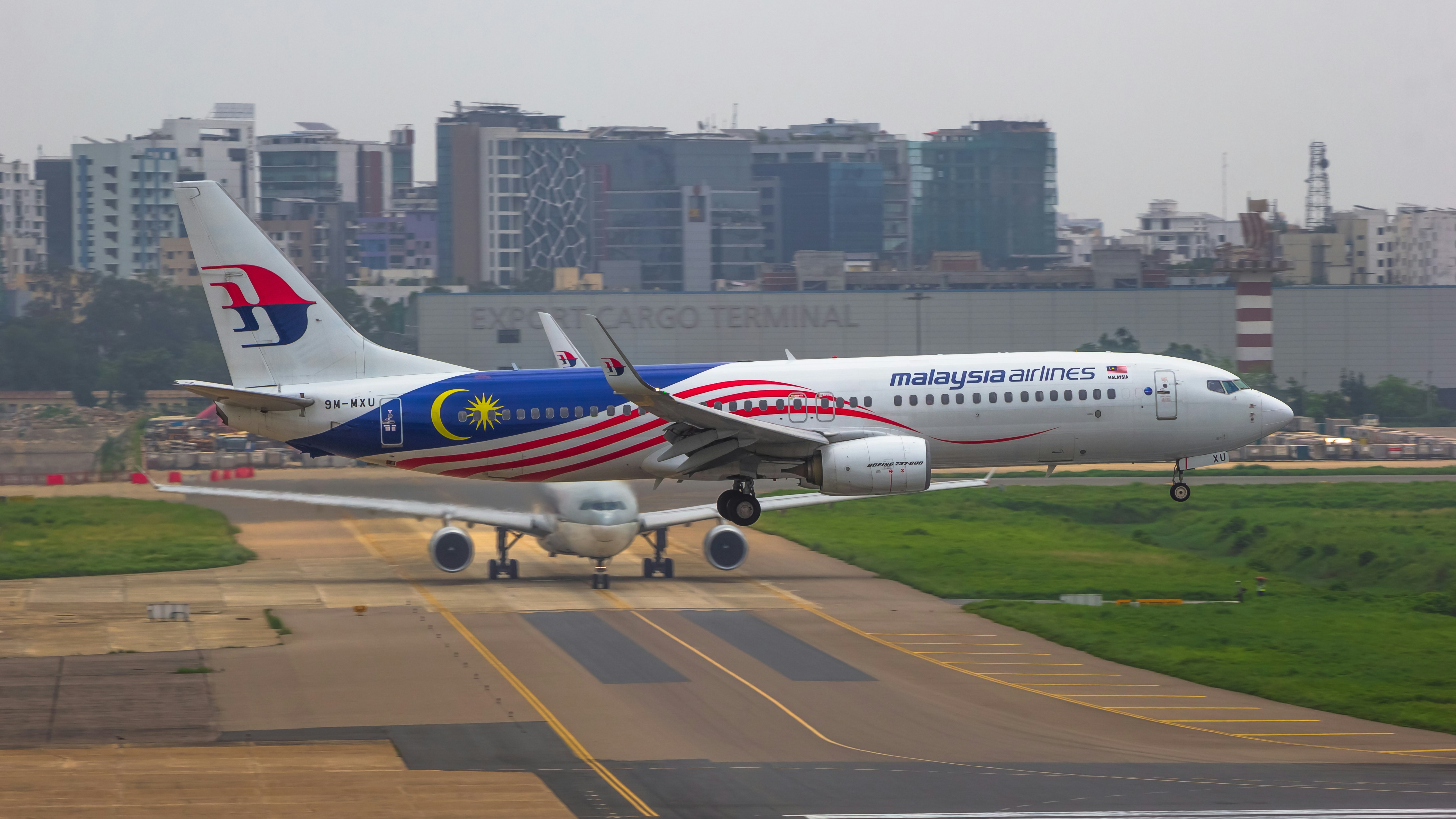 a large jetliner sitting on top of an airport runway