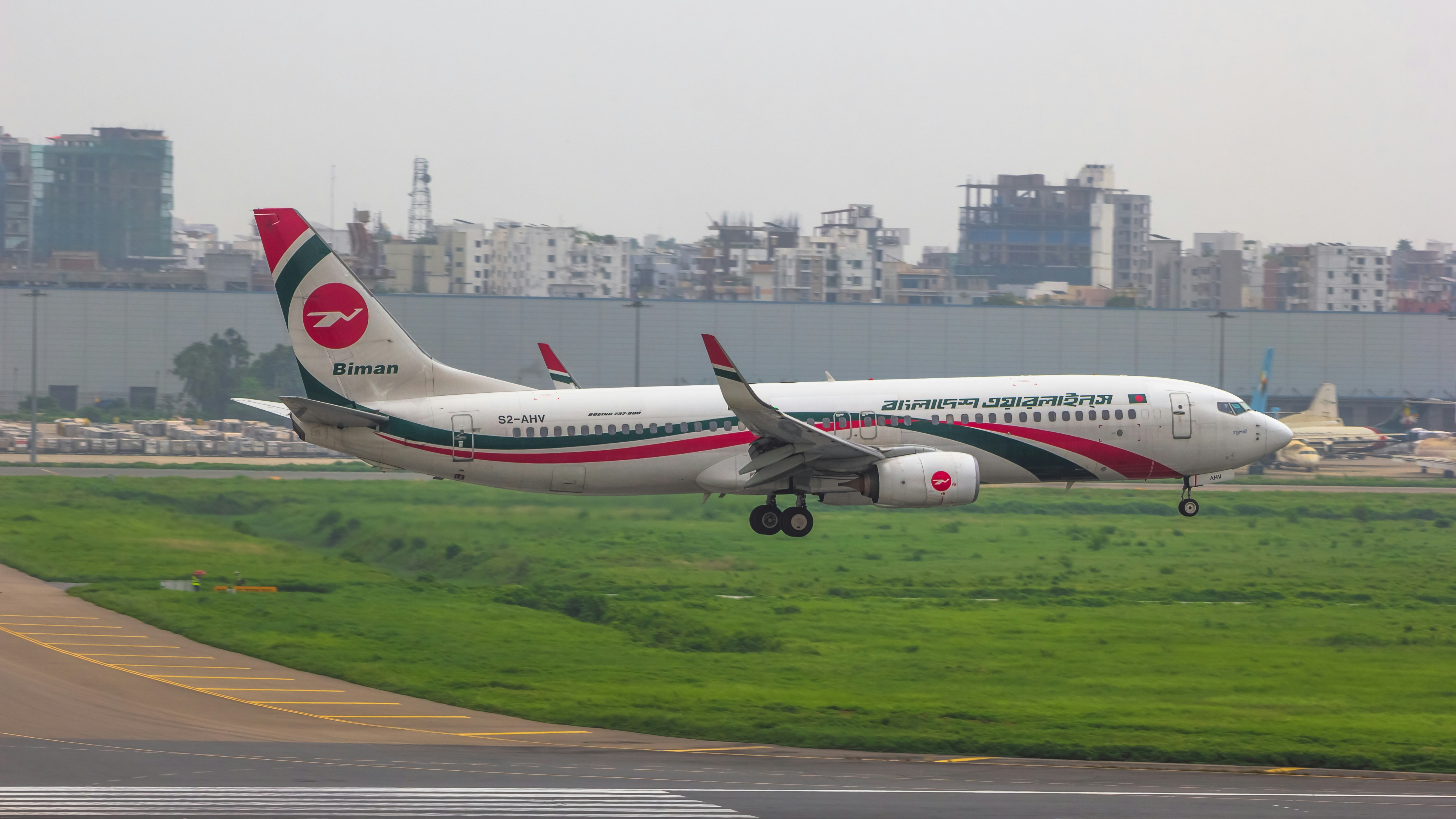 a large jetliner taking off from an airport runway, 