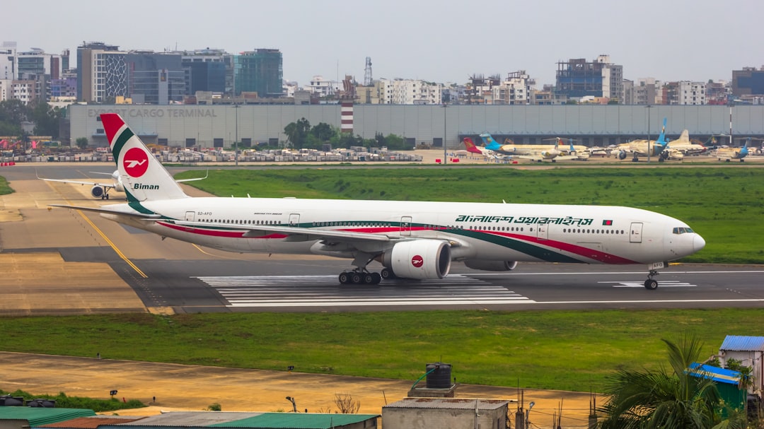 a large jetliner sitting on top of an airport runway,