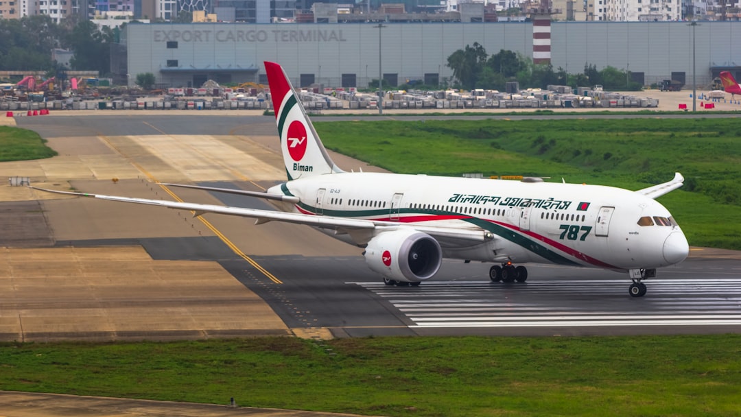 a large jetliner sitting on top of an airport runway,