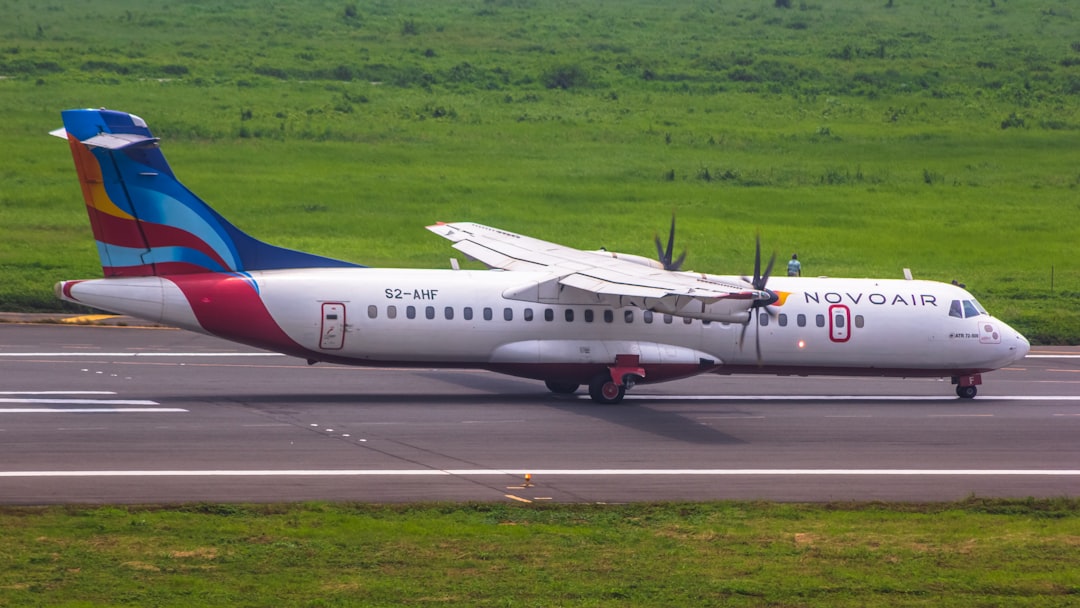 a large jetliner sitting on top of an airport runway,